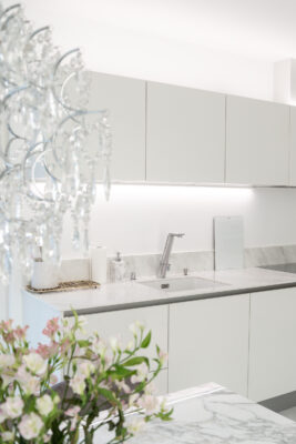 LED strips above the kitchen cabinets and beneath the countertop.